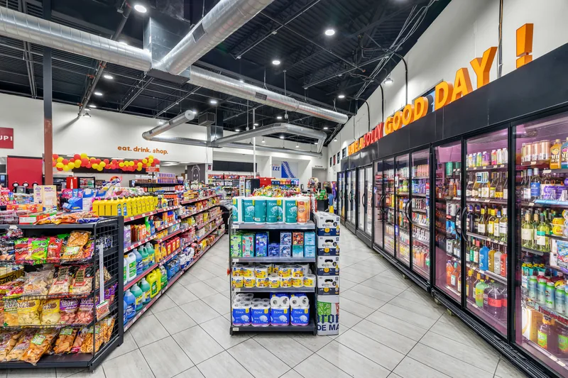 Aisle with coolers and everyday goods